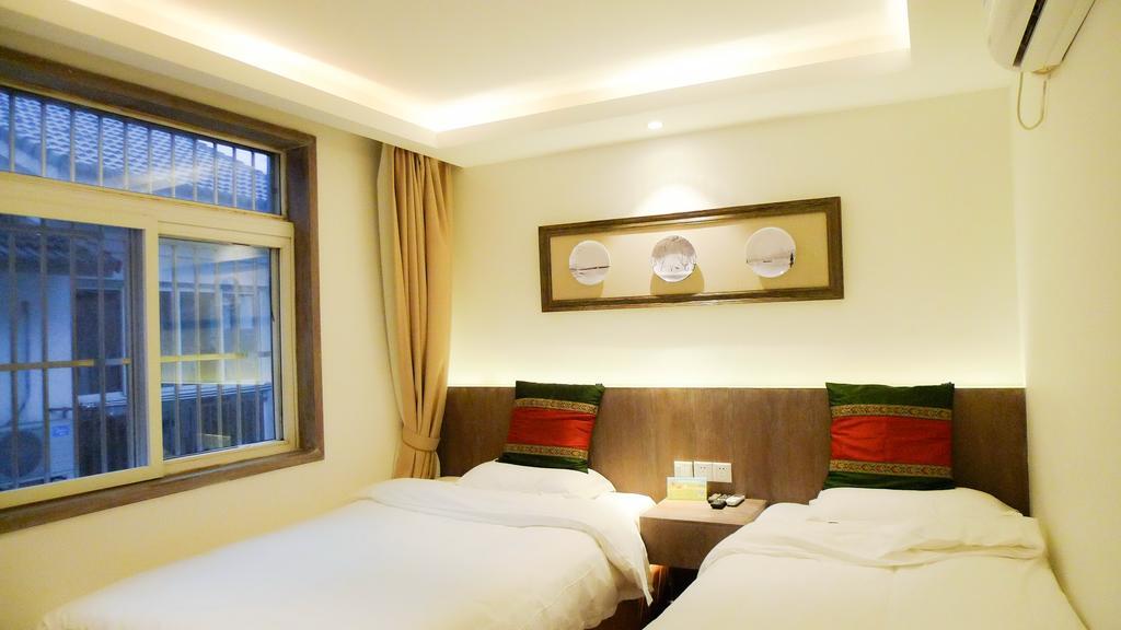 Two Towns Hostel Hangzhou Rum bild